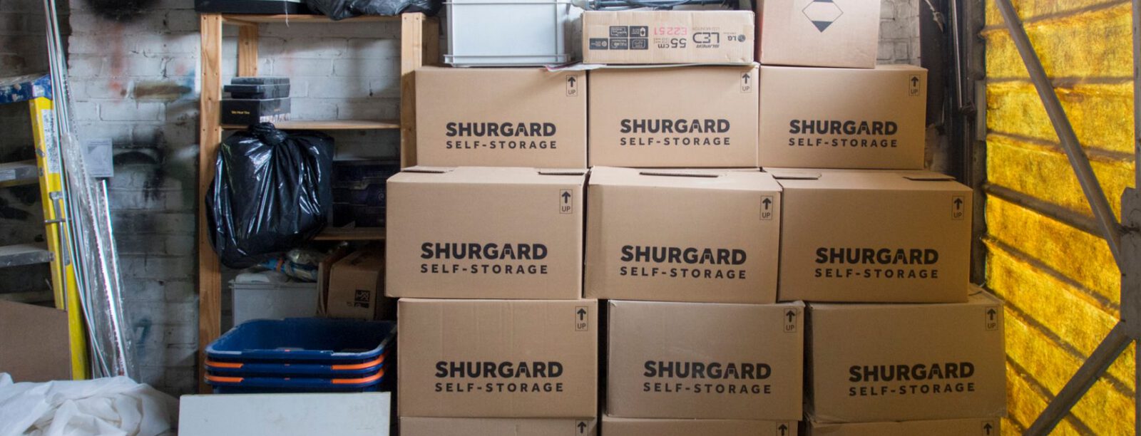 Stacked inventory boxes in a warehouse storage area